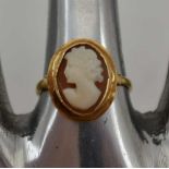 A CAMEO INSET DRESS RING, stamped .750, ring size; "N"