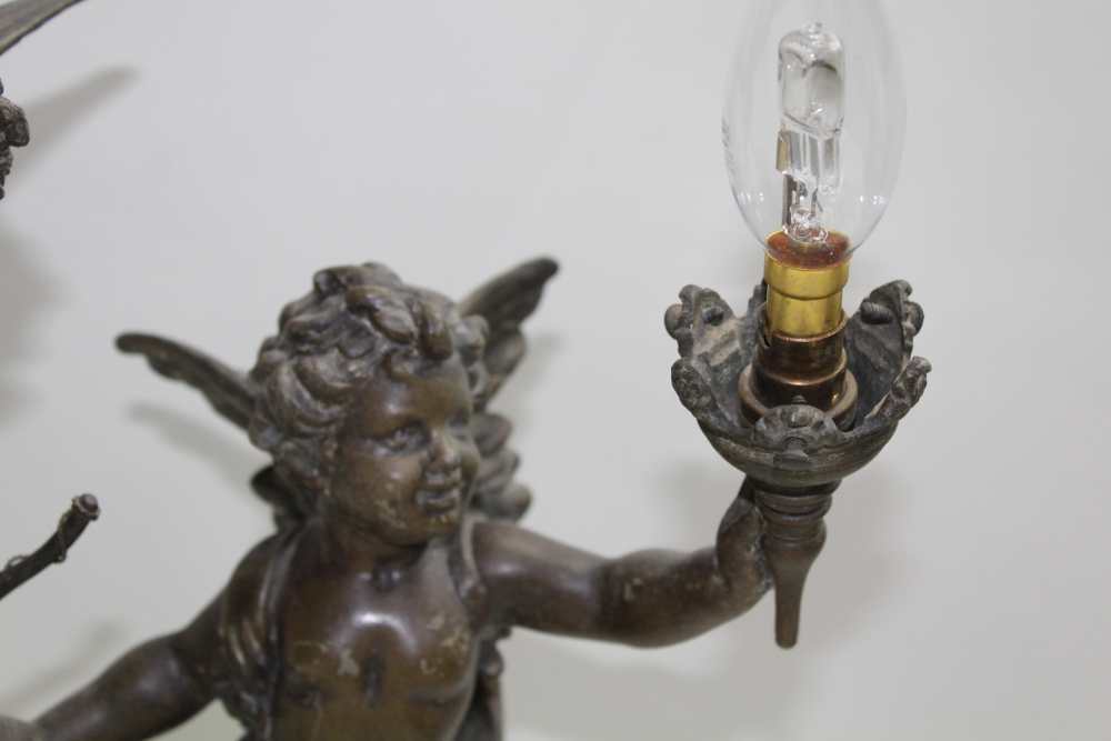 A PAIR OF EARLY 20TH CENTURY FRENCH BRONZE EFFECT SPELTER TABLE LAMPS, of cherub design, both with - Image 5 of 7