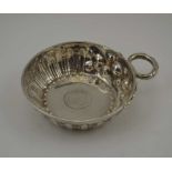 D & J WELBY A SILVER TASTEVIN, the fluted bowl inset with a coin 1568, diameter of bowl; 9.5cm, with