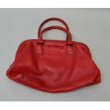 A RED LEATHER "FENDI" HANDBAG, with silver label inside