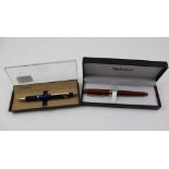 A "MALEDEN" FOUNTAIN PEN, polished wood case with iridium nib, in original presentation case,