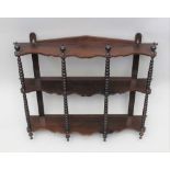 A LATE 19TH CENTURY WALL RACK, three shelves, with bobbin turned decoration, 76cm wide