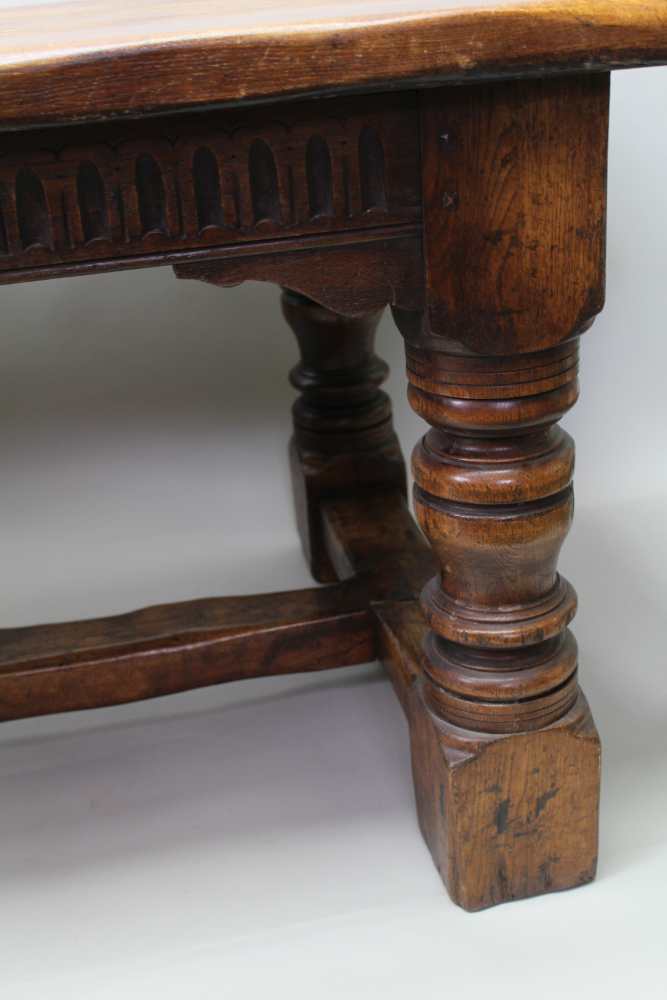 A 17TH CENTURY DESIGN OAK REFECTORY TABLE, having plank top on ring turned supports, with lunette - Image 4 of 5