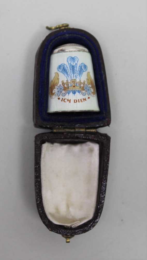 AN ENAMELLED SILVER THIMBLE, commemorating the wedding of Charles & Diana 1981, in case