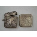 WILLIAM LEWIS AN EDWARDIAN SILVER VESTA CASE, repousse decorated, Birmingham 1903, together with one
