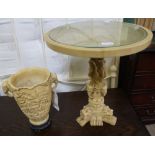 AN IVORY EFFECT CAST RESIN CIRCULAR TOPPED TABLE together with a twin handled vase similar