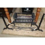 A WROUGHT IRON FIRE BASKET with dogs & three iron utensils