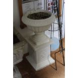 A PAINTED PROBABLE CAST CONTRETE CIRCULAR TOPPED PEDESTAL PLANTER on square plinth base