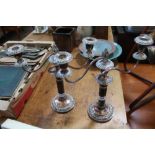 A PAIR OF SILVER PLATE ON COPPER THREE SCONCE TABLE CANDELABRA