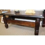 AN OAK FINISHED RECTANGULAR TOPPED COFFEE TABLE on substantial turned blocked legs