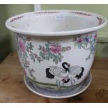 AN ORIENTAL HAND PAINTED POTTERY PLANTER on saucer stand