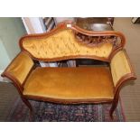 A CONTINENTAL DESIGN BEECH FRAMED OLD GOLD UPHOLSTERED WINDOW SEAT having padded back