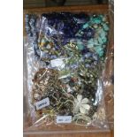 A SEALED BAG OF COSTUME JEWELLERY & associated items