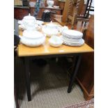 A MODERN BEECH RECTANGULAR TOPPED TABLE on black painted base