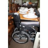 A MODERN FOLDING WHEELCHAIR