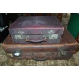 A VINTAGE TAN SUITCASE together with a travelling valise