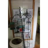 A METAL FRAMED GARDEN BIRD FEEDER together with a metal climbing plant frame