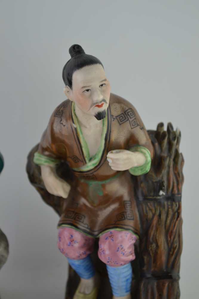 TWO ORIENTAL CERAMIC FIGURES, polychrome decorated, one a seated figure with a fan, the other seated - Image 3 of 5