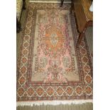 A GEOMETRIC PATTERNED RECTANGULAR FLOOR RUG, with multi guard border