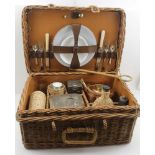 A 1920's WOVEN CANE MOTORING PICNIC HAMPER branded "Coracle", with original fittings by G.W. SCOTT &