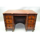 A LATE 19TH / EARLY 20TH CENTURY FANCY DESIGNED MAHOGANY TWIN PEDESTAL DESK, having plain top with