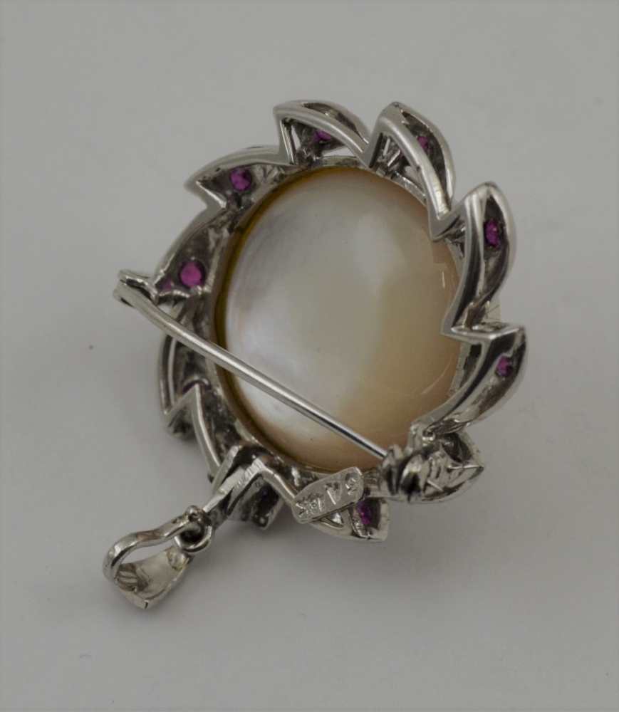 AN 18K WHITE GOLD BROOCH (set pendant hoop) with central pearl, the frame inset ten cut ruby - Image 2 of 3