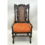 A 17TH CENTURY DESIGN TURNED & CARVED ARMCHAIR, with crown crest, having bergere back and seat, with