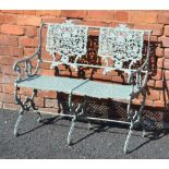 A 20TH CENTURY POSSIBLY FRENCH PAINTED METAL GARDEN TWO-SEATER BENCH, with scrolling foliate back