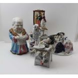 A COLLECTION OF FIVE LATE 19TH CENTURY CONTINENTAL CERAMIC FIGURATIVE ITEMS, to include; four