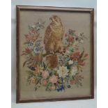A 19TH CENTURY NEEDLEWORK AND PLUSH WORK PANEL, depicting a Bird of Prey within a wreath, summer