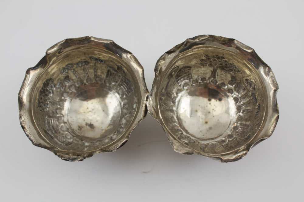 A PAIR OF EASTERN WHITE METAL SWEETMEAT BOWLS, repousse decoration in the round, landscape with palm - Image 3 of 3