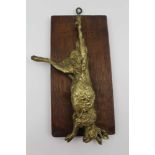 AFTER MENE AN ORMOLU CAST HANGING GAME PANEL, mounted upon an oak panel, stamped "Mene" 20cm x 12cm