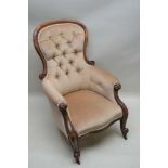 A 19TH CENTURY MAHOGANY SHOW WOOD FRAMED BUTTON BACK ARMCHAIR, having neutral velour upholstery,