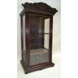 A PART 19TH CENTURY & LATER ADAPTED ORIENTAL DISPLAY CABINET, decoratively carved frieze, over