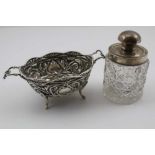 HENRY MATTHEWS A VICTORIAN SILVER SWEETMEAT DISH, of twin handle design, repousse decoration,