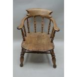 A 19TH CENTURY ELM SMOKERS BOW CAPTAIN ARMCHAIR, of typical form & construction, with well figured