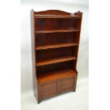 A LATE 19TH / EARLY 20TH CENTURY FREE-STANDING MAHOGANY SET OF OPEN SHELVES, having two door box