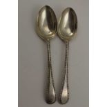 JAMES DEAKIN & SONS A PAIR OF EDWARDIAN SILVER SERVING SPOONS, beaded Hanoverian handles,