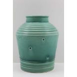 A SUSIE COOPER POTTERY VASE of tapering cylindrical form, ridged and impressed dots, green glazed,