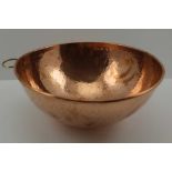 A HEAVY GAUGE HAND PLANISHED COPPER ZABAGLIONE BOWL, with brass hanging ring, 26cm in diameter