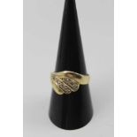 A 14K GOLD DIAMOND SET RING, swirl design set seven brilliant cut stones, gross weight; 4.2g, ring