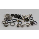 A QUANTITY OF FINGER RINGS, many silver, of varying designs, some enamel inlaid, some stone set,