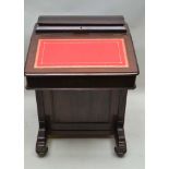 A LATE 19TH / EARLY 20TH MAHOGANY FINISHED DAVENPORT DESK, with lift-up stationery storage