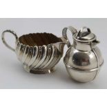 HILLIARD & THOMASON A LATE 19TH CENTURY SILVER CREAM JUG of wrythen form, with beaded handle, gilded