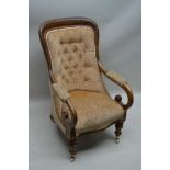 A 19TH CENTURY MAHOGANY FRAMED GENTLEMAN'S ARMCHAIR, with scrolling arms, having neutral velour