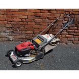 A LAWNFLITE PRO GRASS CUTTER, with Honda petrol driven motor, grass collection box, model 553HRS,