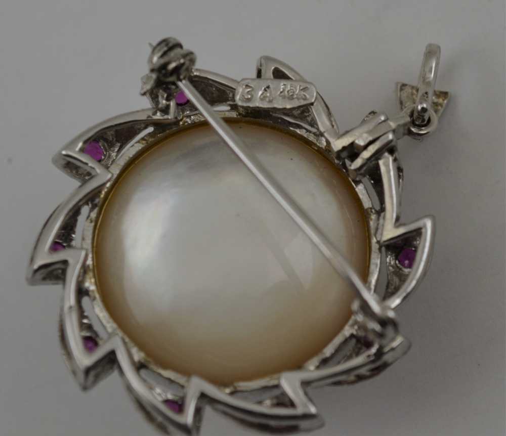 AN 18K WHITE GOLD BROOCH (set pendant hoop) with central pearl, the frame inset ten cut ruby - Image 3 of 3