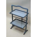 A RETRO DESIGNED METAMORPHIC FIRESCREEN / CAKE STAND, finished in blue and black rattan, with