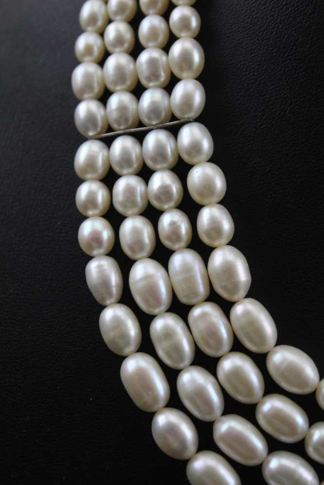 A PEARL NECKLACE, four strands of graduated cultured pearls with silver fastening, - Image 3 of 5