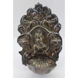 AN 18TH CENTURY CONTINENTAL REPOUSSE SILVER HOLY WATER STOUP, which would have been hung in the